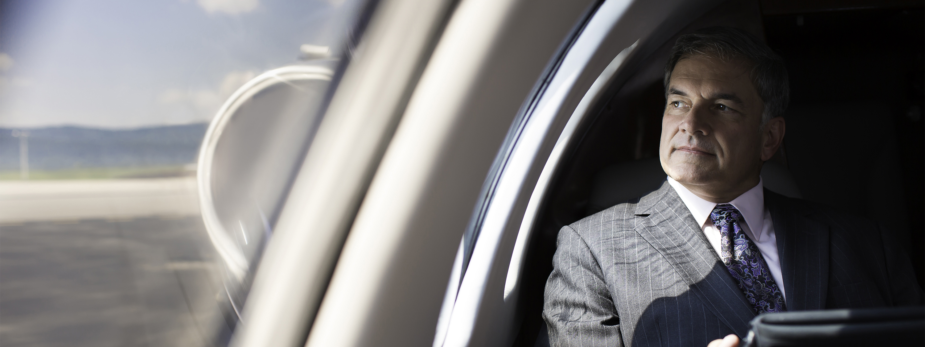 Business leader flying on private plane