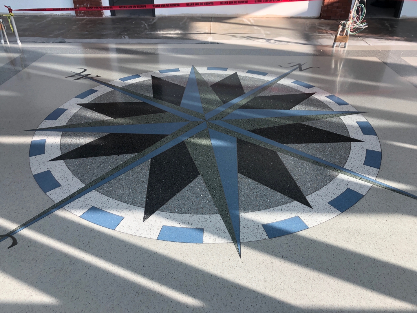 decorative compass inlaid into the floor