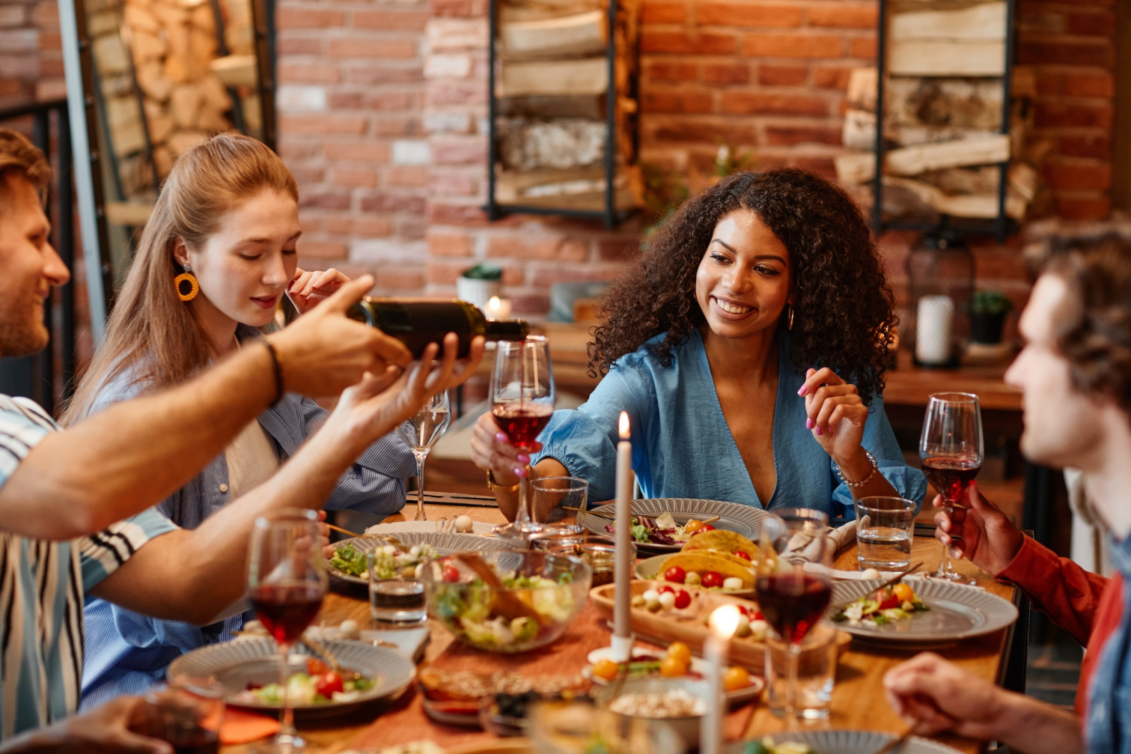 people enjoying food at a table