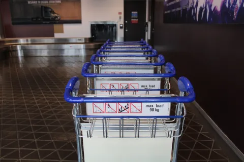 Several luggage carts stacked together