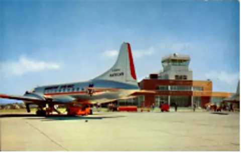 historic aircraft parked at an airport
